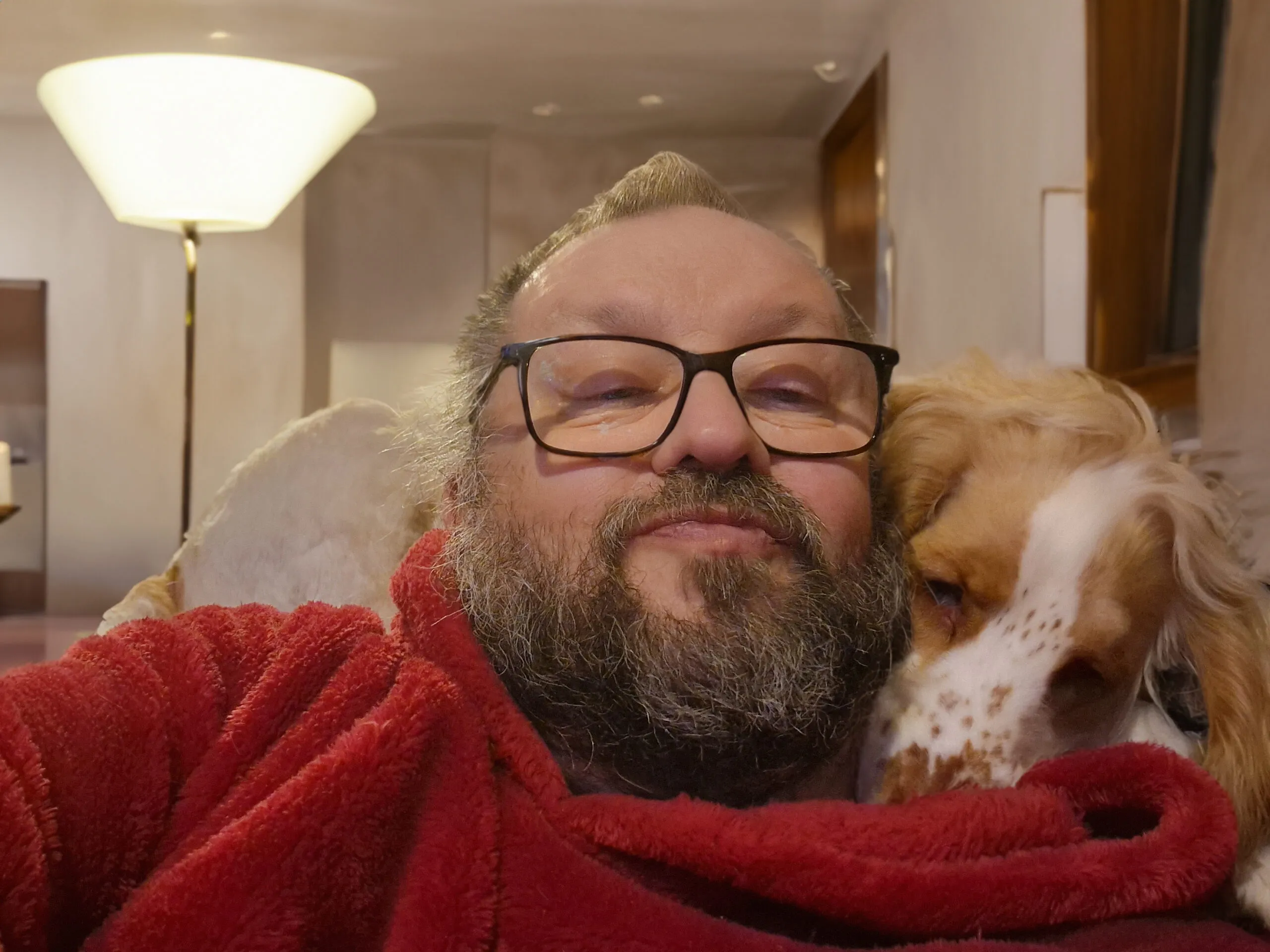 Gary sitting at home with Dexter resting closely beside him