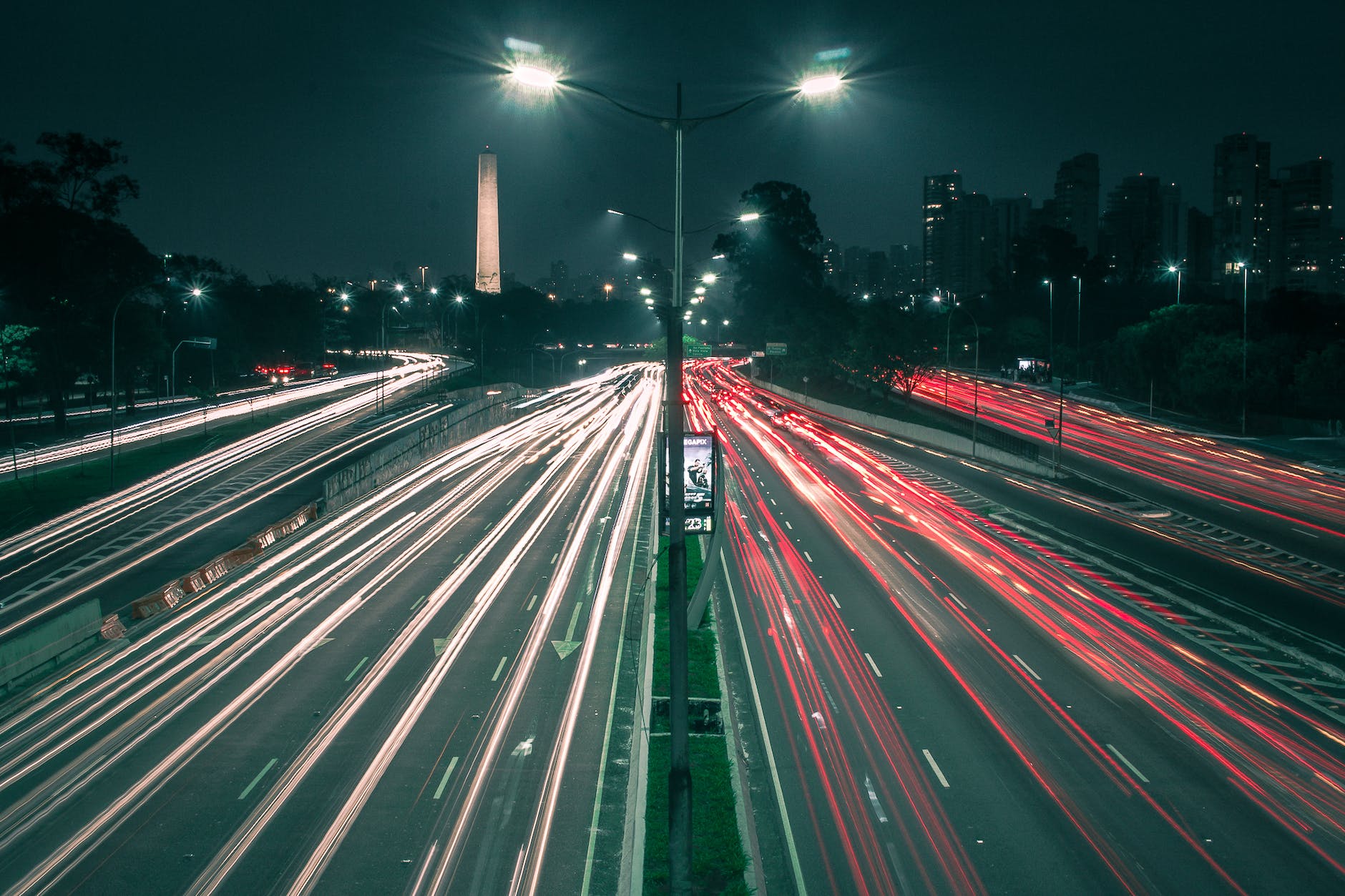 light trails on city street at night